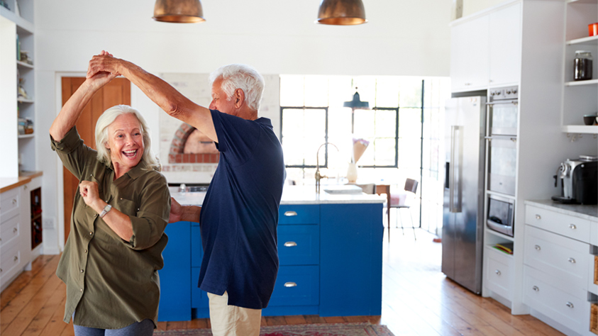 Couple dancing in kitchen