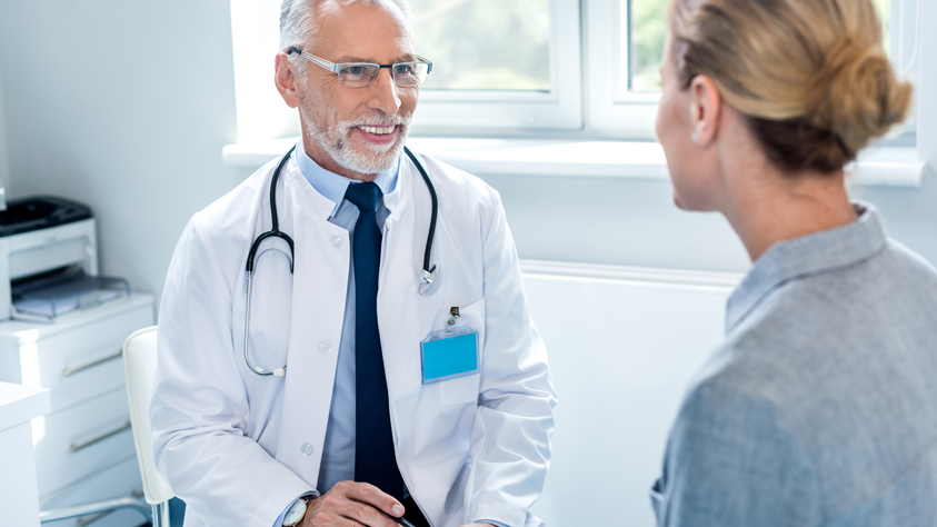 Male doctor with patient