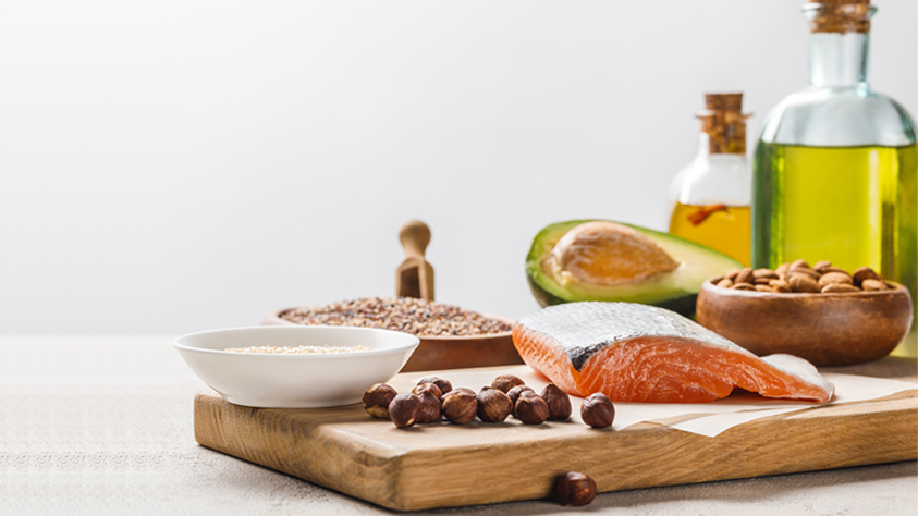 Salmon, oil and nuts on a tray